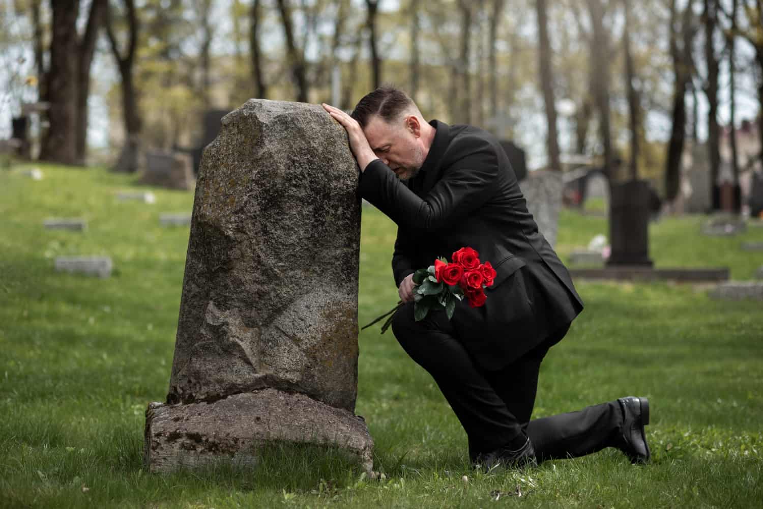 Mourning brother at grave due to wrongful death