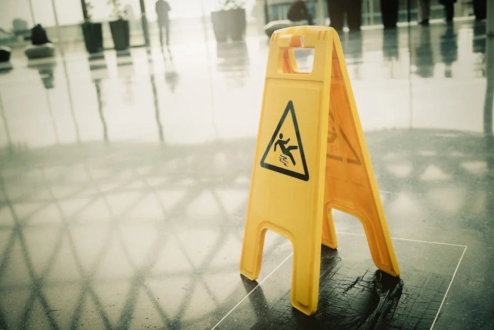 Ottawa Slip and Fall Accident Lawyers Wet floor warning sign representing slip and fall accident claims in Ottawa